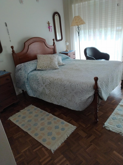Sunny double bedroom with a balcony