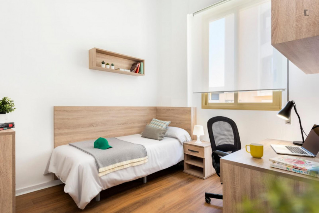 Bed in a cosy twin bedroom, in Bami