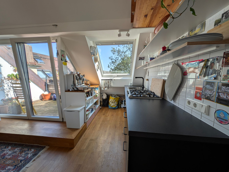Bright & Stylish Attic Apartment with Balcony, Fireplace, and Wood Accents