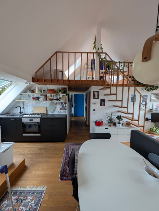 Bright & Stylish Attic Apartment with Balcony, Fireplace, and Wood Accents