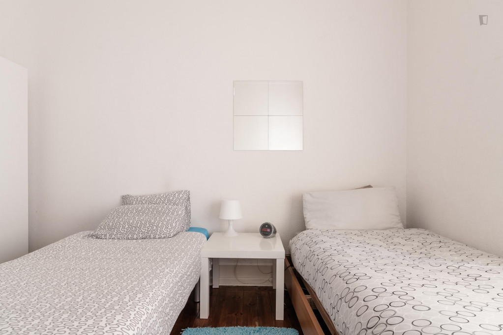 Twin bedroom with balcony in student apartment near Areeiro metro station