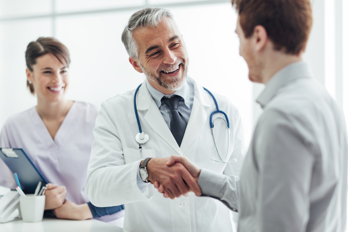 Doctor saying goodbye to a student patient