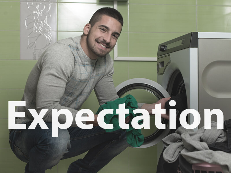Student doing his laundry regularly