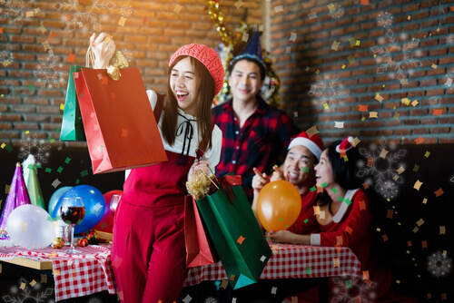 students opening Christmas gifts